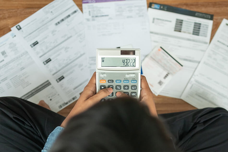 Borrower calculating loan repayments